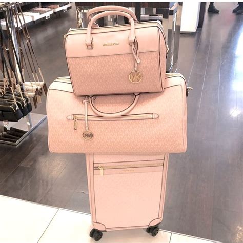 michael kors black carryon|Michael Kors pink suitcase.